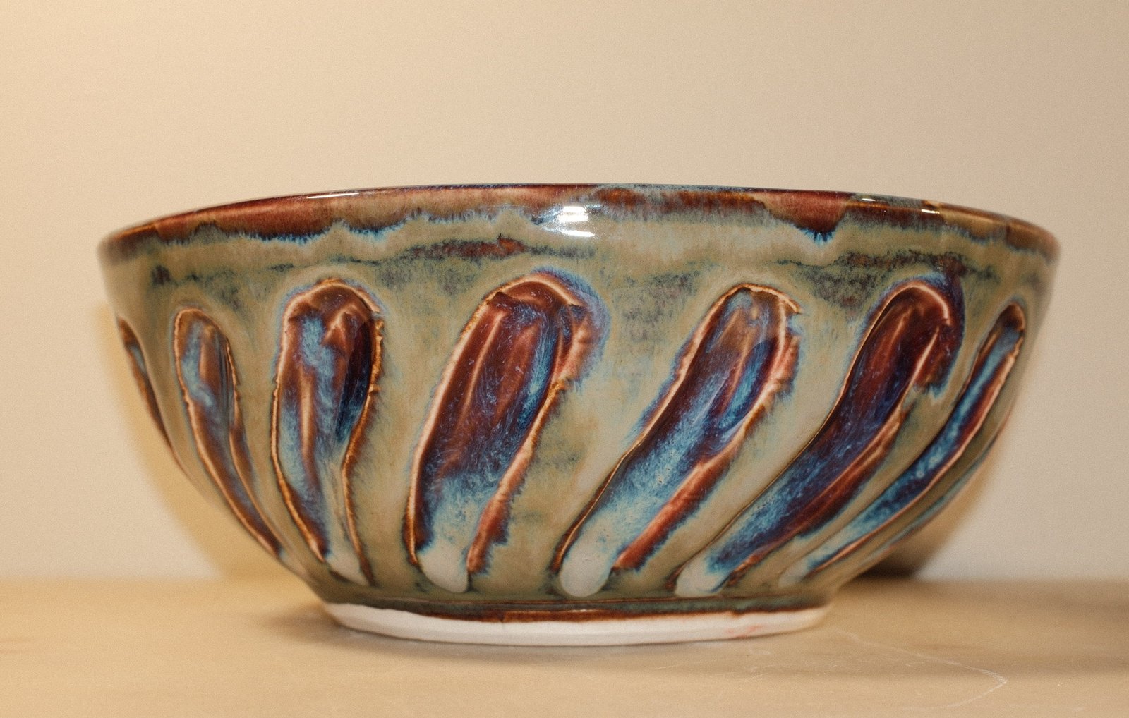 Blue Rutile and Claret bowl, carved rim