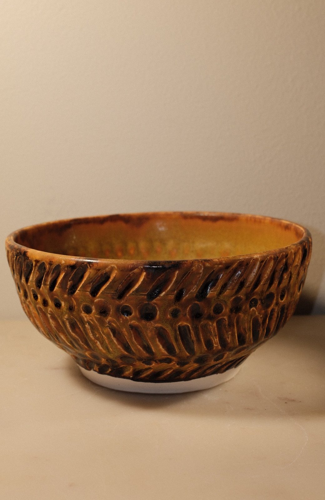 Scoria bowl with carved sulphur detail