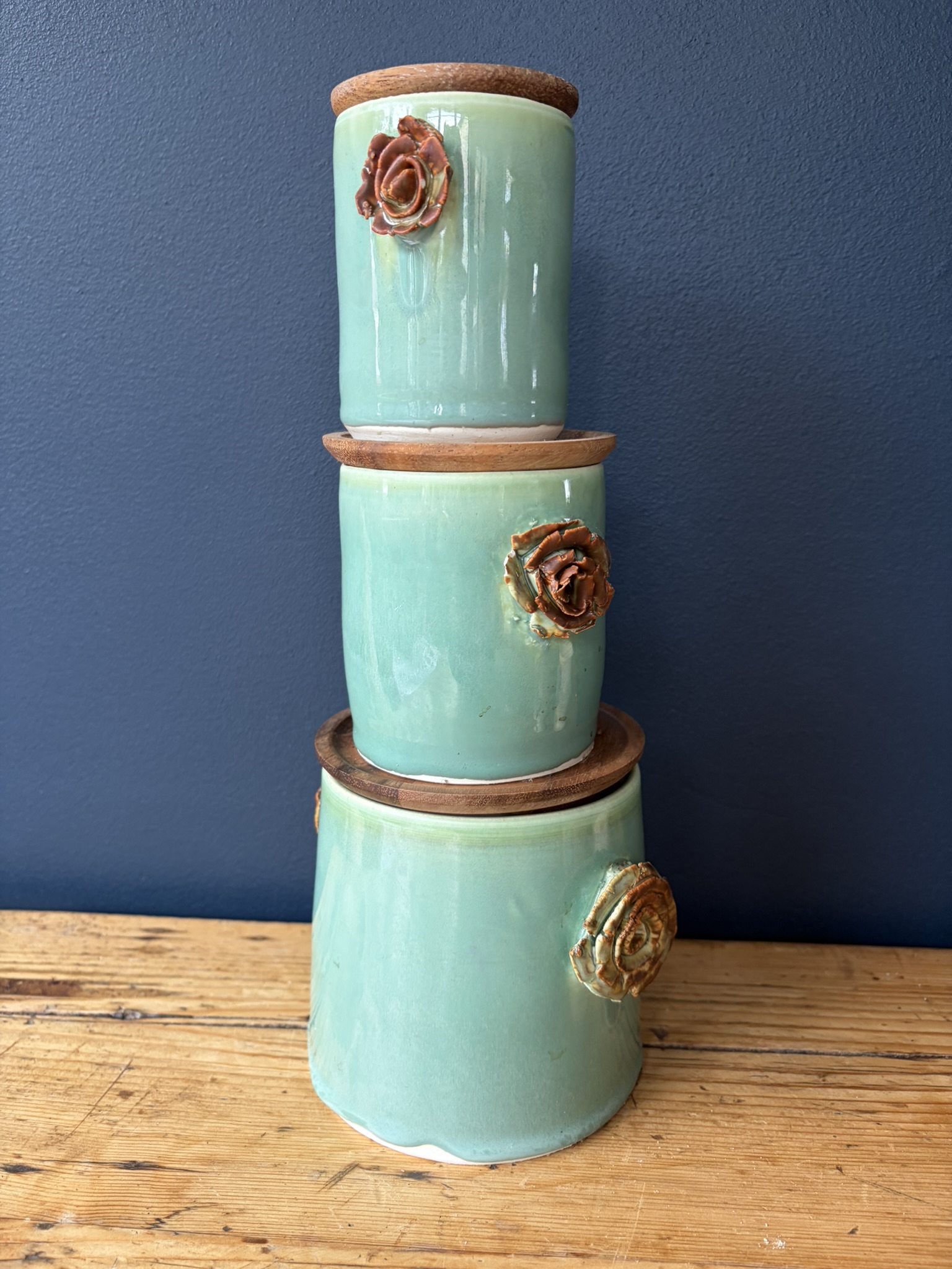Set of 3 green rose handle wood lid canisters