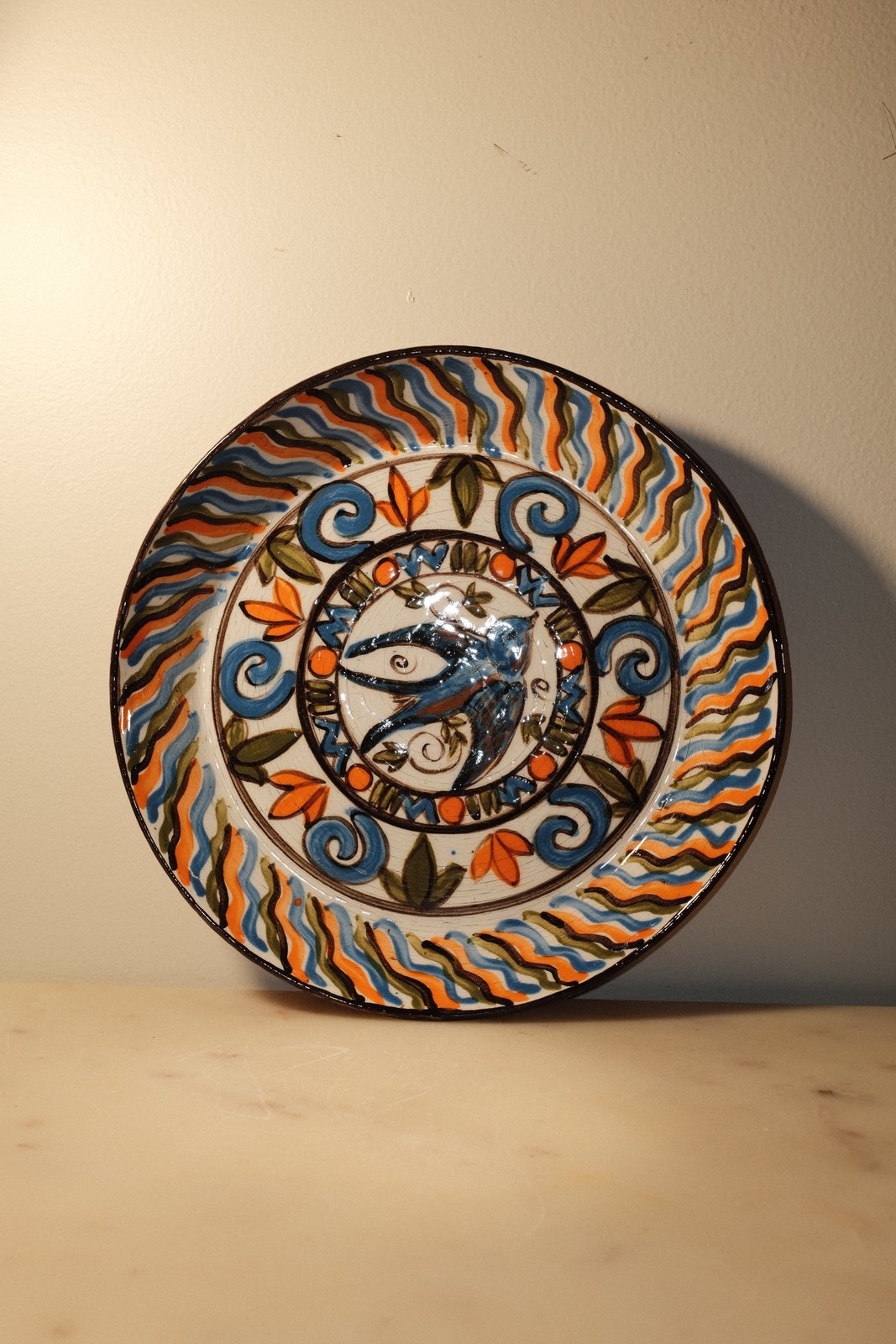 Hand-painted bird plate, gloss over underglaze