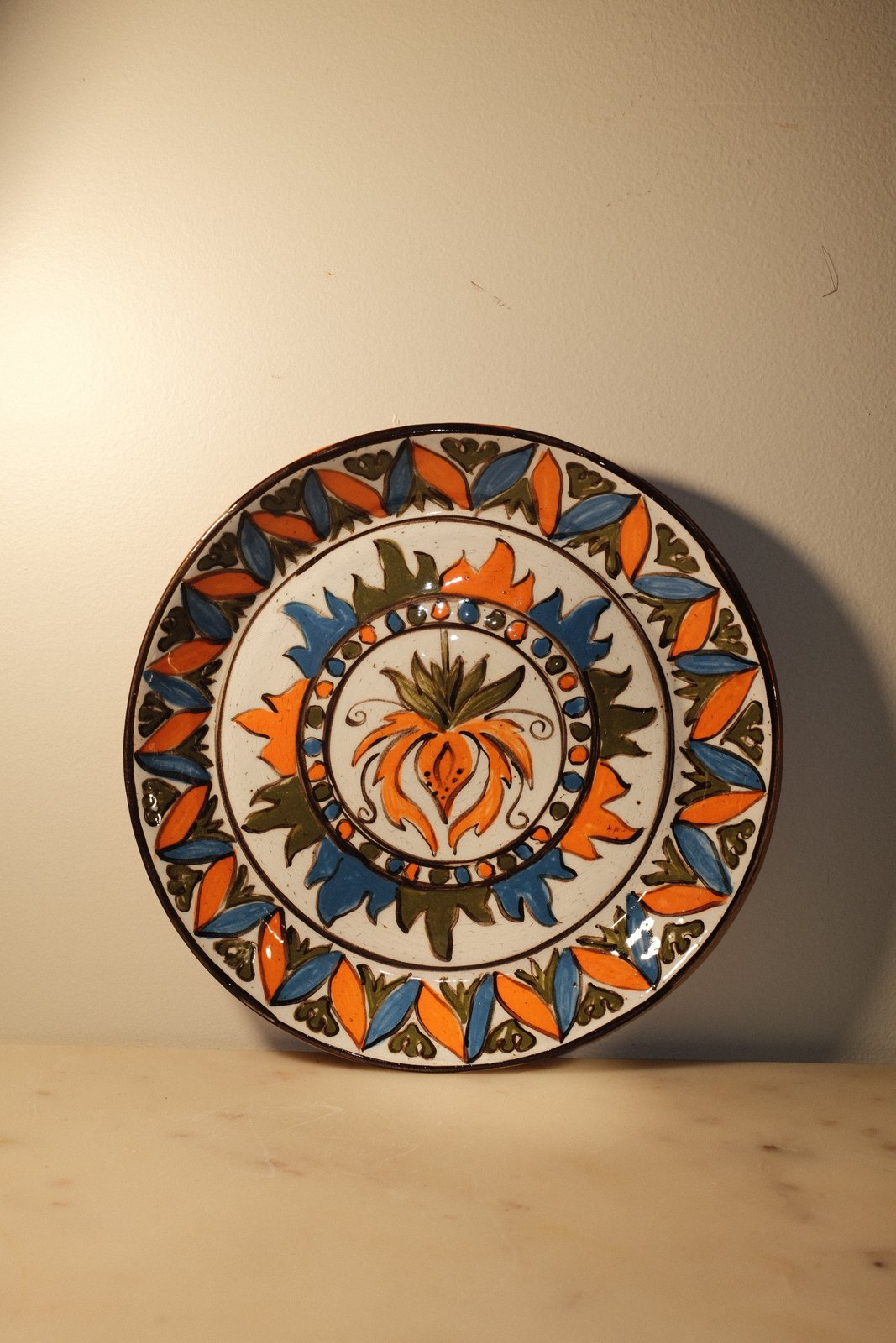 Hand-painted orange flower plate, gloss over underglaze