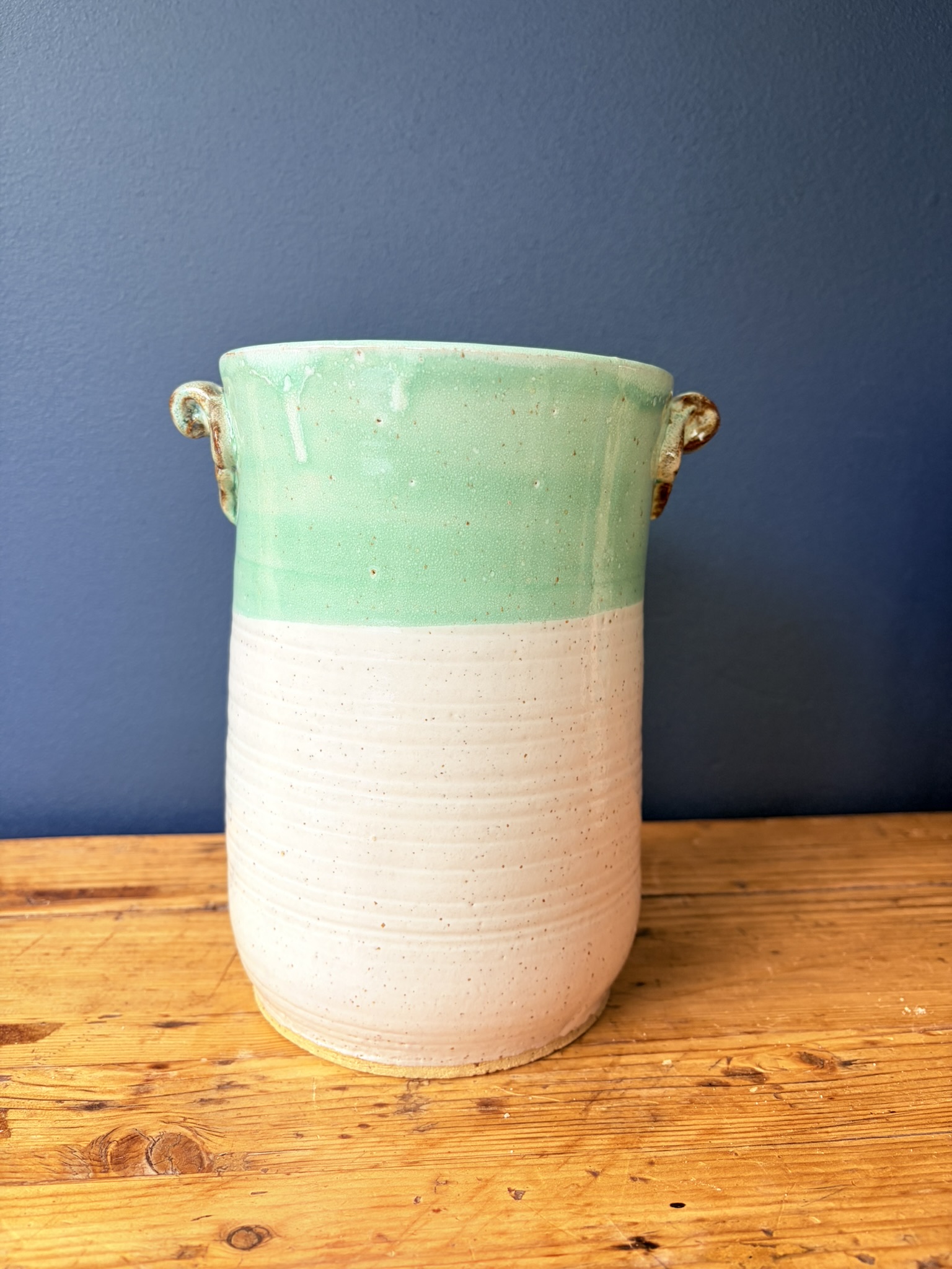 Green and white vase with scroll lugs